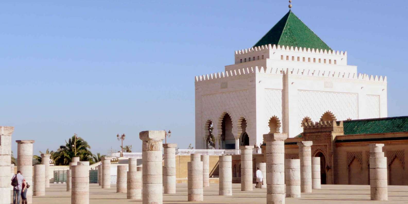 Exterior view of the iconic Mohammed V Mausoleum, a historic architectural marvel showcasing intricate design and cultural significance in Rabat, Morocco.