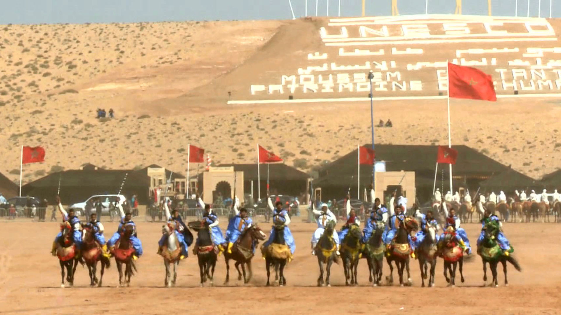 Vibrant cultural celebration at the Moussem of Tan-Tan featuring traditional music, dance, and colorful costumes.