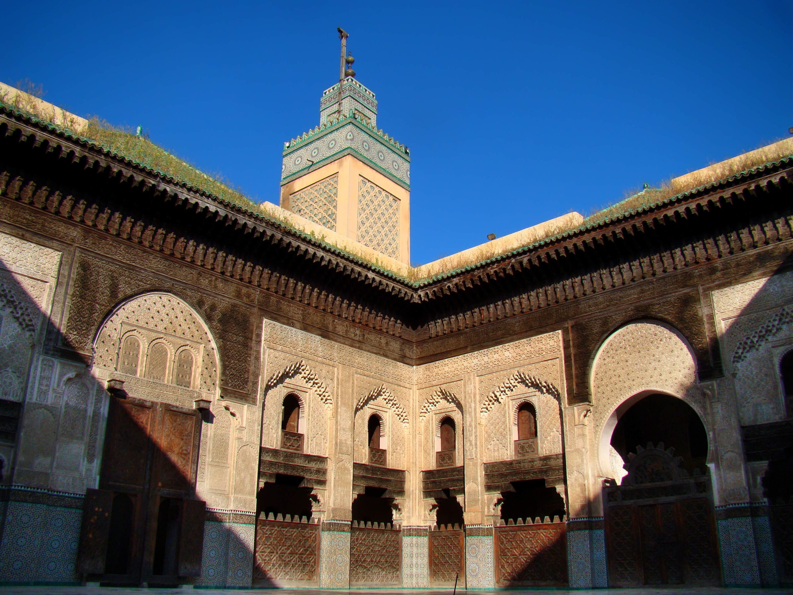 Image of Bou Inania Medersa, a beautifully scaled architectural masterpiece showcasing intricate details.